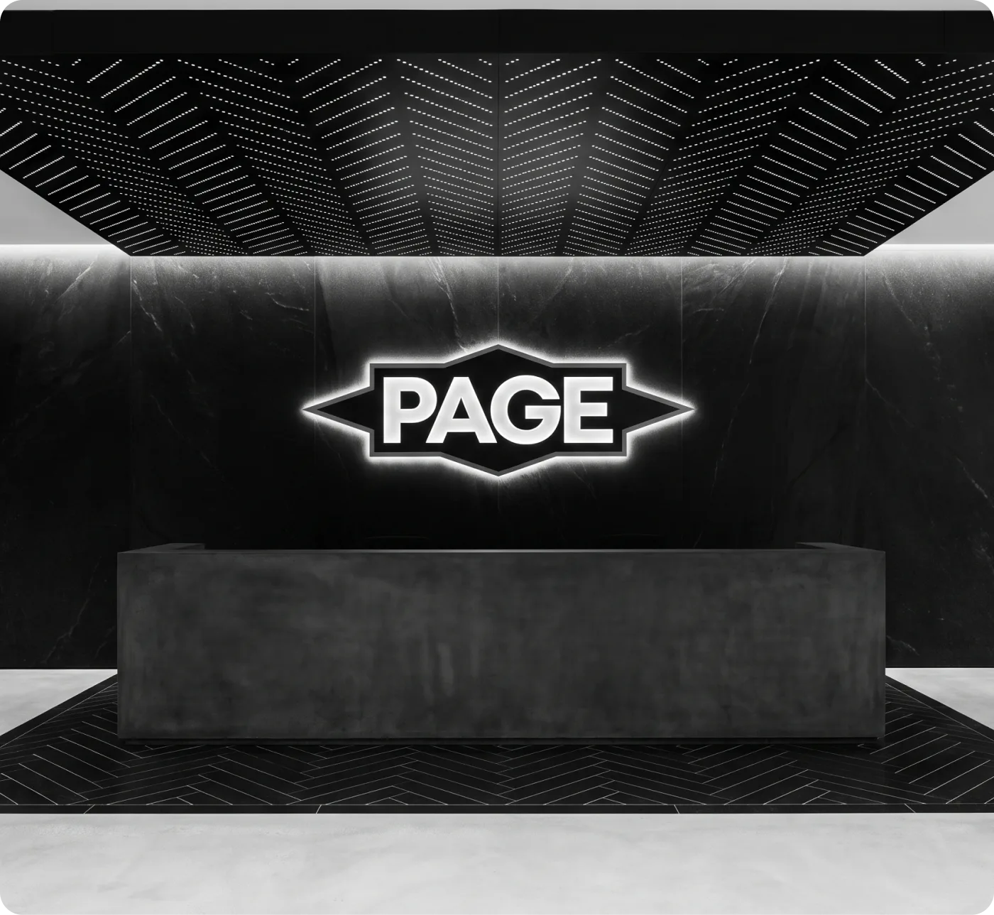 Page Flooring logo lit above a reception desk